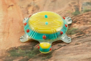 Beautiful Zuni Turtle Fetish Created by Zuni Artist Laura Quam. Signed by the Artist. Hand carved from Turquoise, Mother of Pearl, Melon Shell and Coral. 
